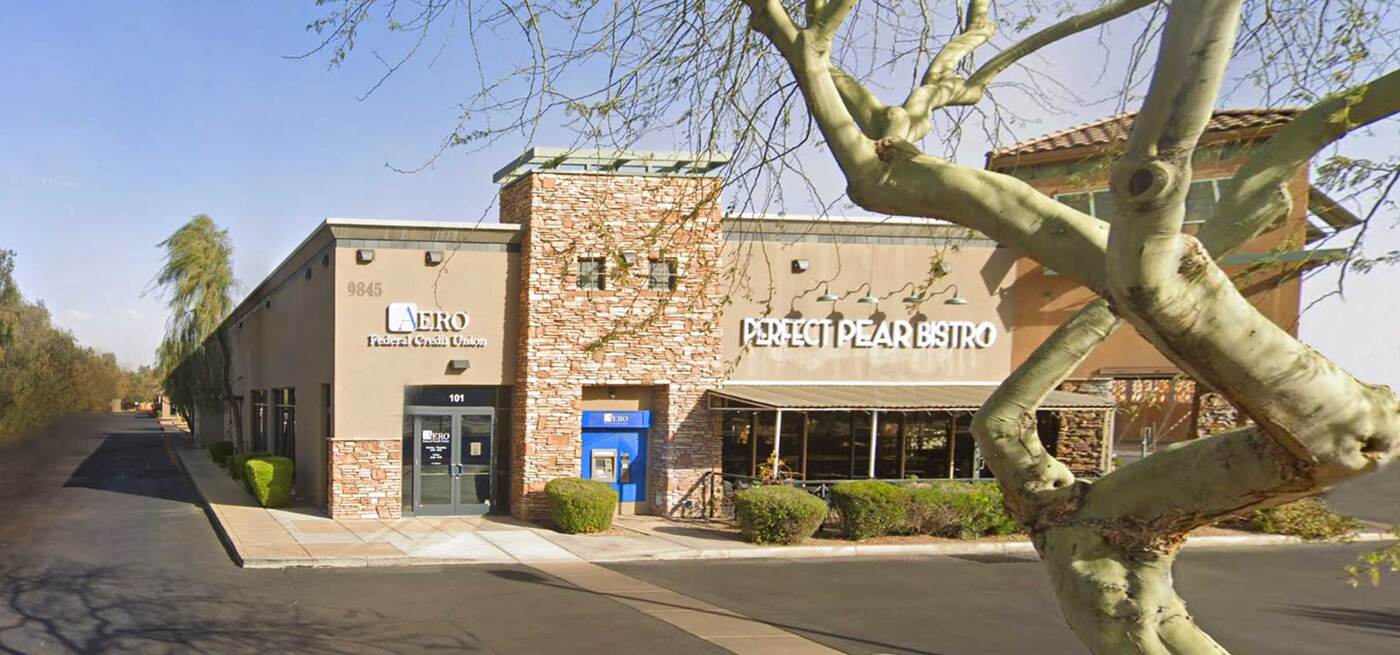 Street view of the Perfect Pear Bistro landmark at the entrance to the OneSource office complex