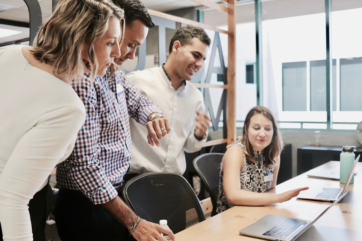 Human resources professional meeting with colleagues in an office