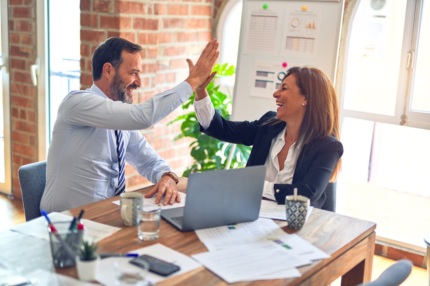 Business professionals collaborating on employer service options